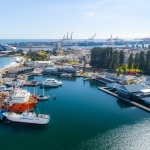 Aerial view of Fremantle Fishing Boat Harbour with commercial fishing boats and views over Bathers Bay and Fremantle Port in the backgroundt