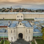 Aerial view of Fremantle Prison site showing the main gatehouse and cell blocks 